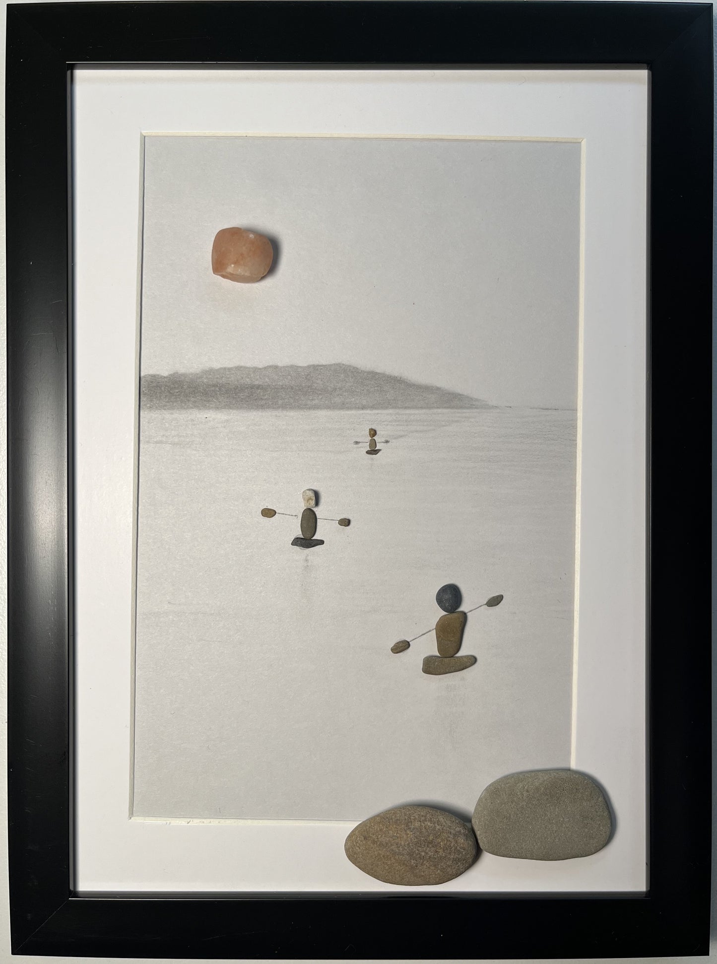 pebble art 3 kayakers in a lake under the sun