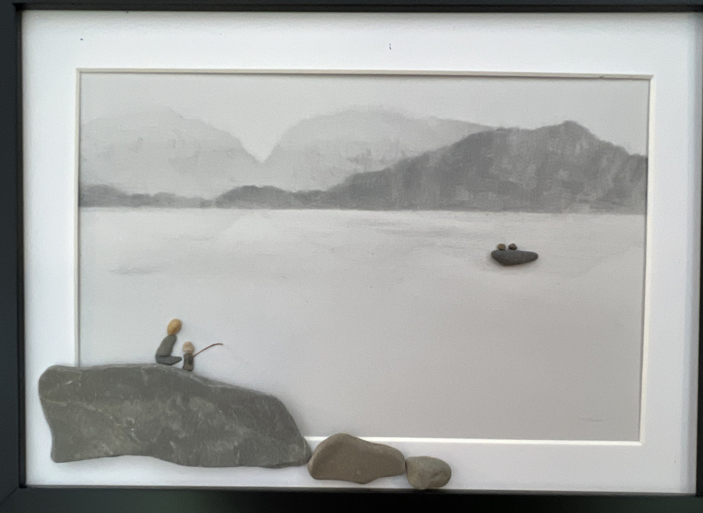 mother and daughter fishing on a lake with a boat in the background